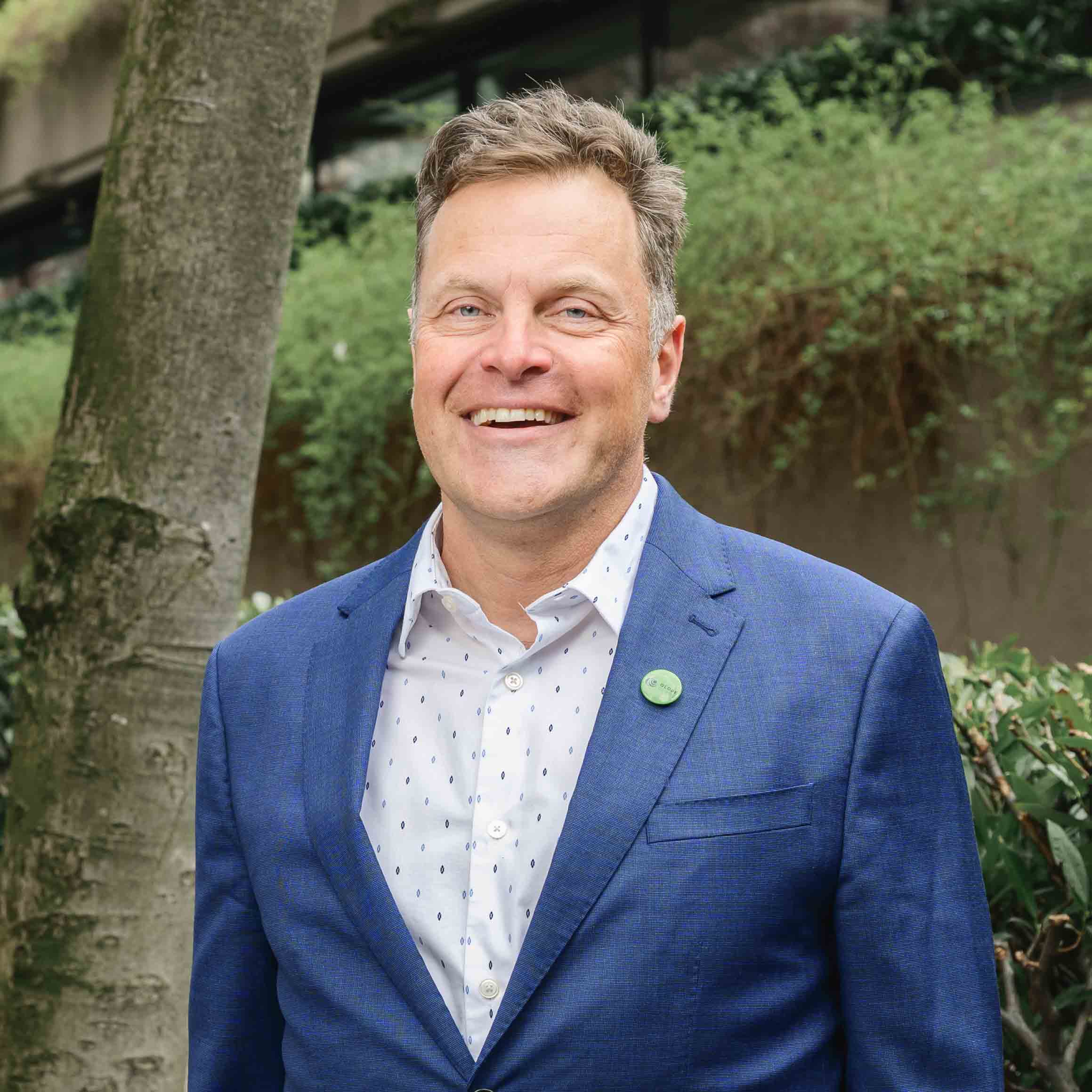Jeremy Valeriote - BC Greens Candidate for West Vancouver-Sea to Sky Jeremy Valeriote, BC Greens candidate for West Vancouver-Sea to Sky, smiling in a blue suit jacket outdoors.